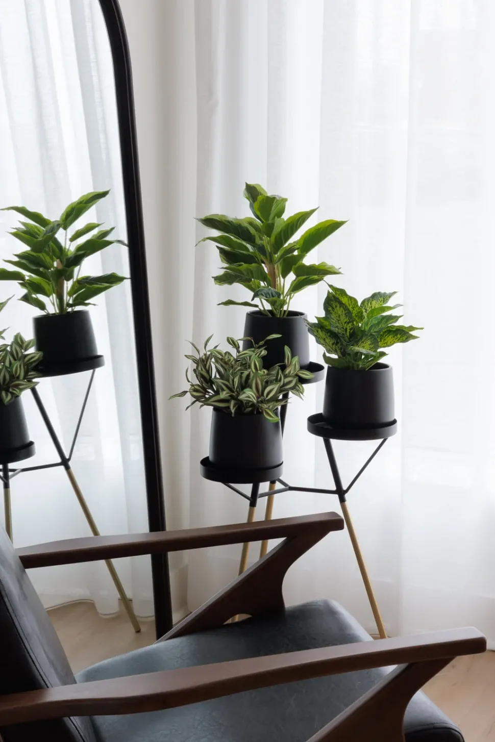Artificial green aglaonema in a black pot