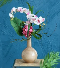 Artificial pink tropical flowers in a vase
