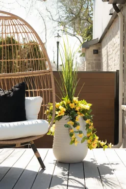 Artificial yellow hibiscus in a grey terrazzo beige pot, 55"