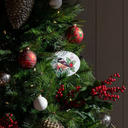 Bird metal disk Christmas ornament, 5 x 6"