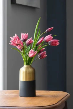 Black and gold iron vase