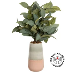 Bouquet of artificial eucalyptus in a pink vase