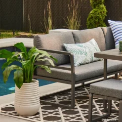 Outdoor artificial curcuma in a grey terrazzo beige pot, 30 x 16